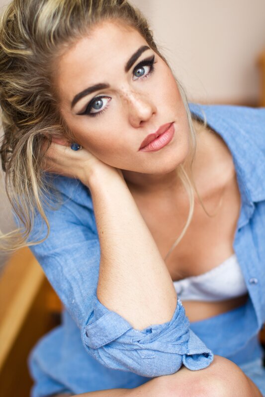 woman in blue shirt resting