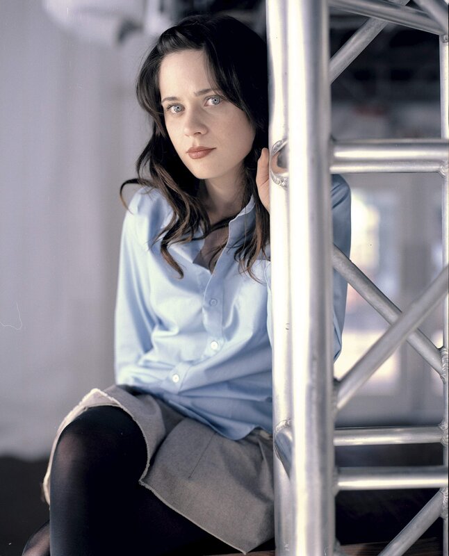 woman in blue shirt sitting
