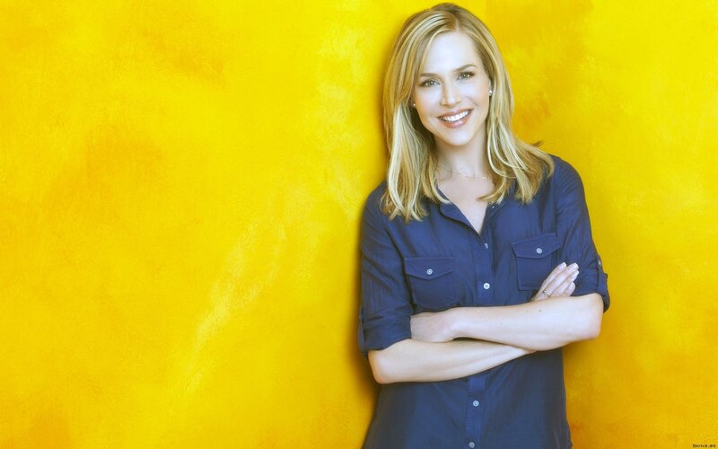 woman in blue shirt smiling