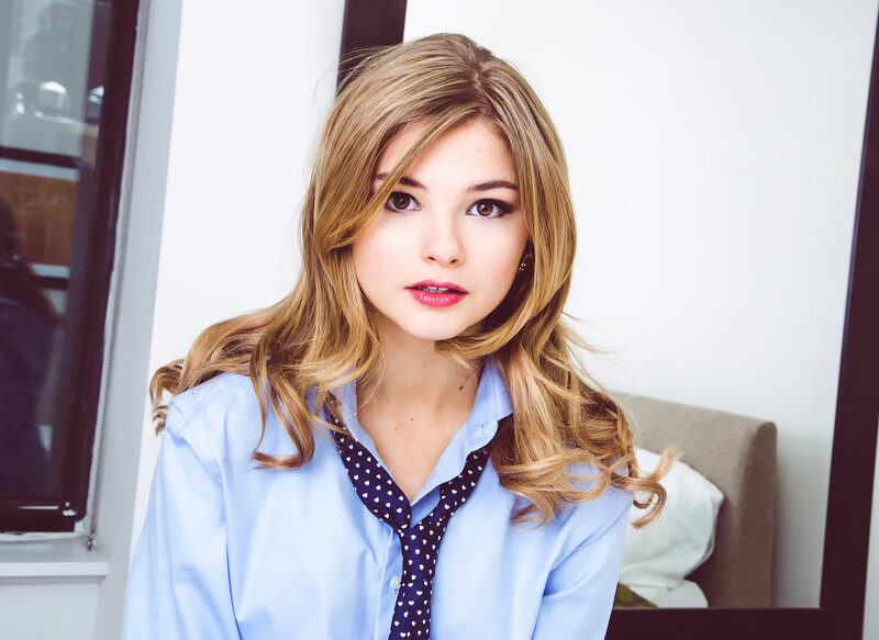 woman in blue shirt with tie