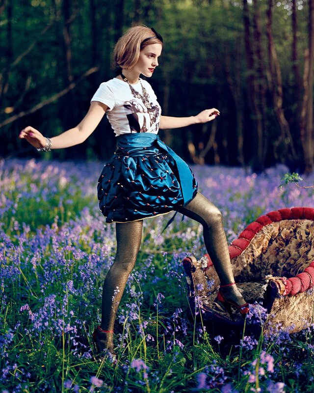 Woman in blue skirt in flower field