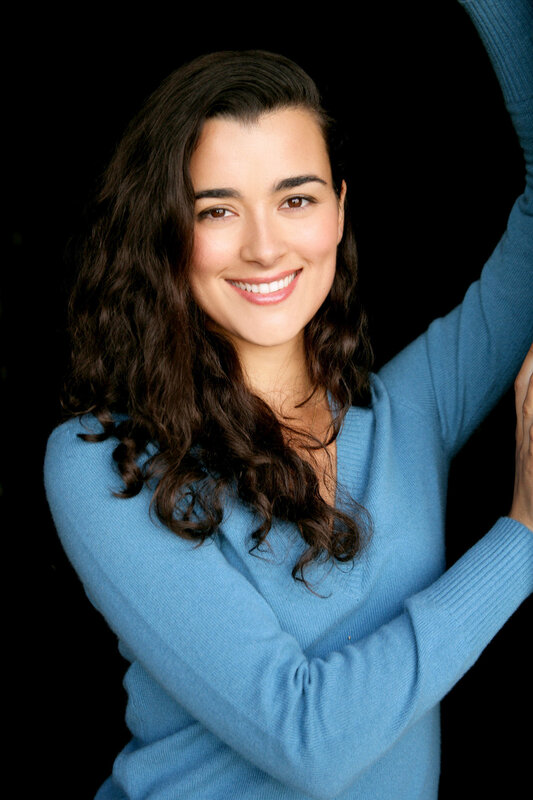 woman in blue sweater smiling