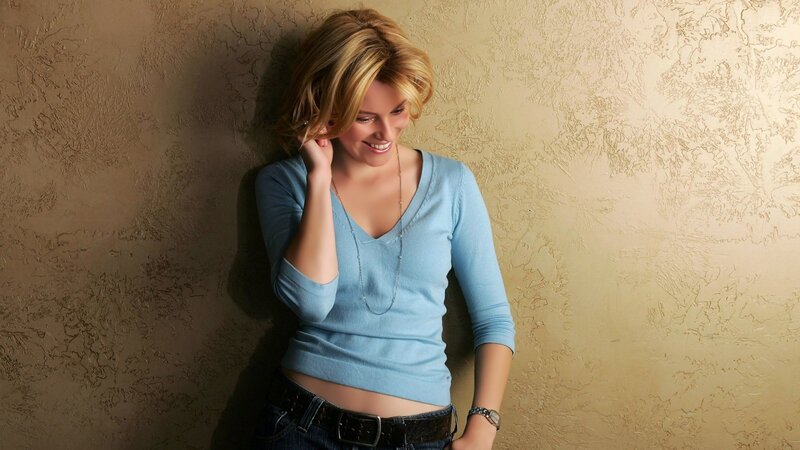 woman in blue sweater smiling