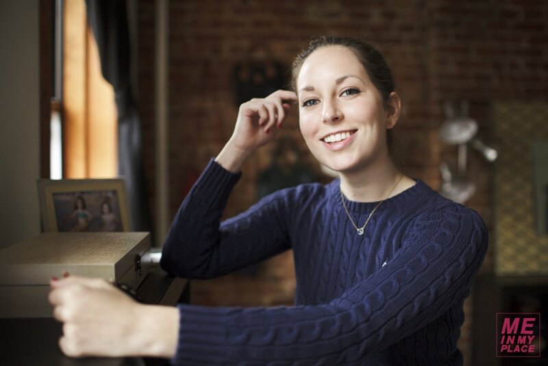woman in blue sweater smiling