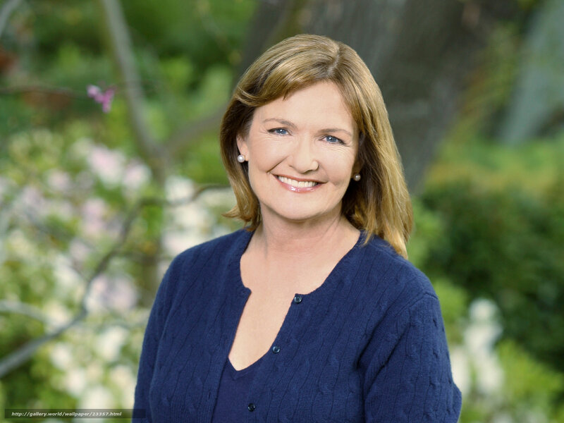 woman in blue sweater smiling