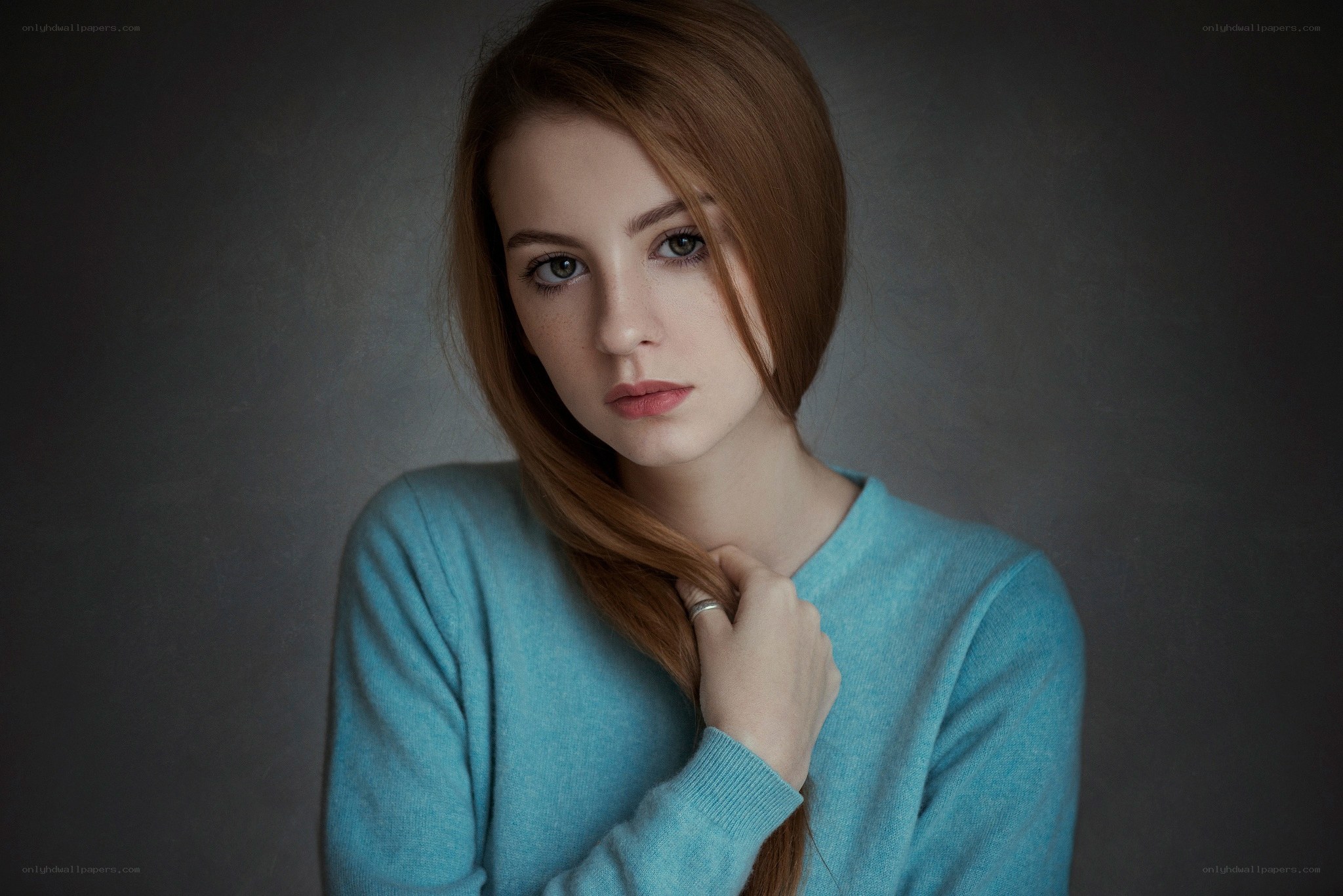 woman in blue sweater