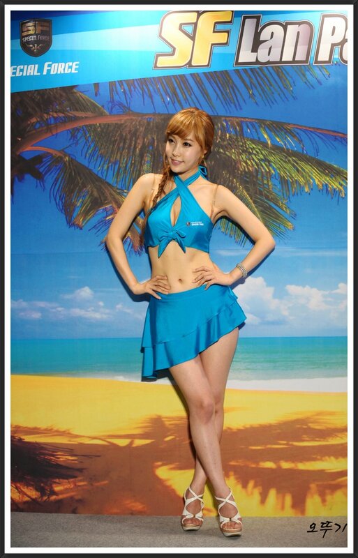Woman in blue swimsuit at event