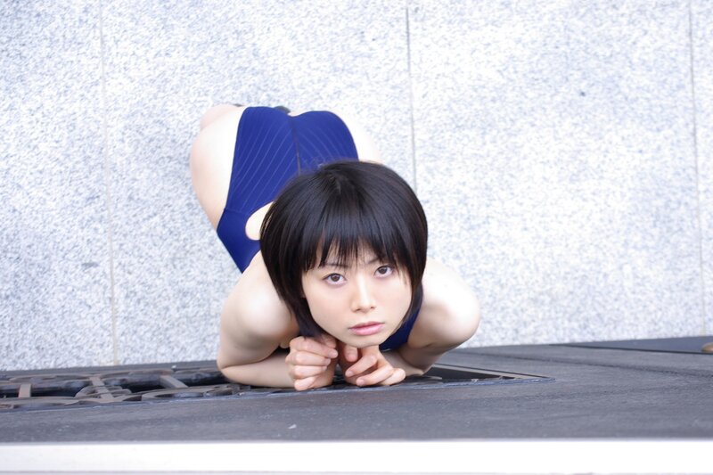 woman in blue swimsuit on ground