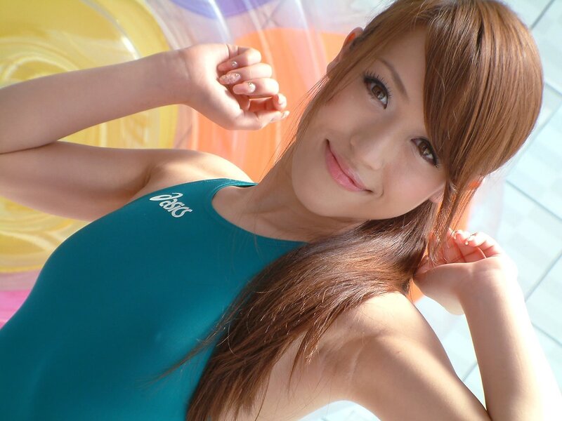 woman in blue swimsuit smiling