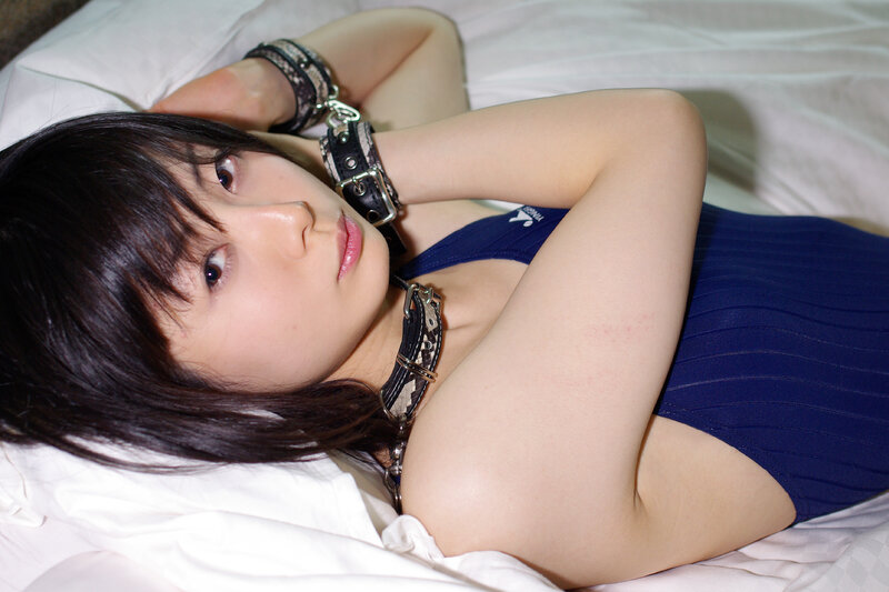 woman in blue swimsuit with restraints