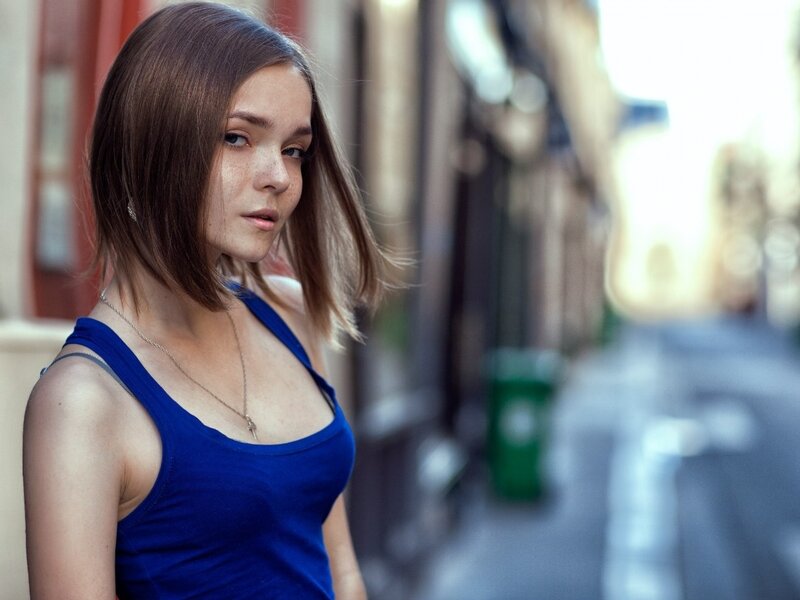 woman in blue tank top on street
