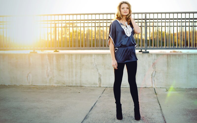 woman in blue top at sunset