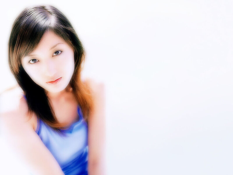 woman in blue top looking at camera
