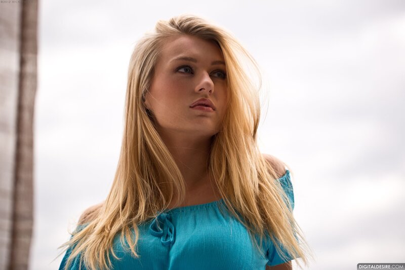 woman in blue top looking up