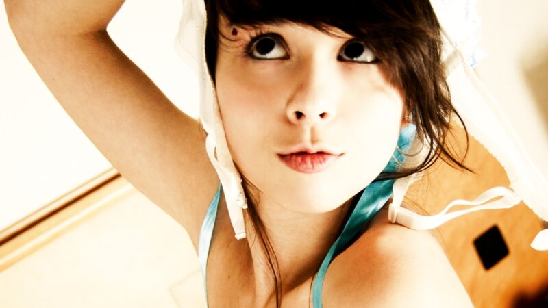 woman in blue top looking up
