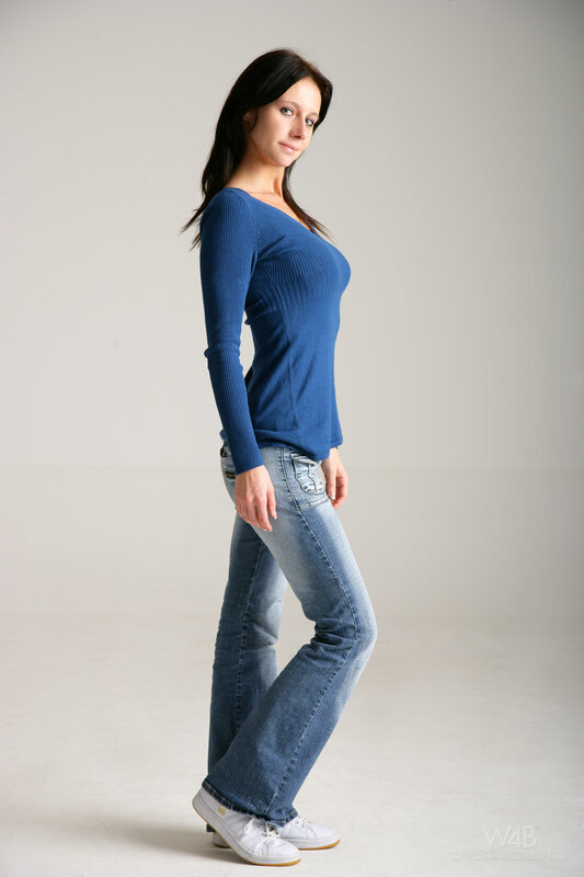 Woman in Blue Top — Neutral, Photograph, Jeans, Sneakers