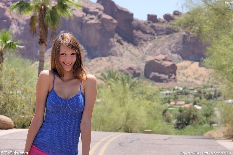 Woman in blue top outdoors