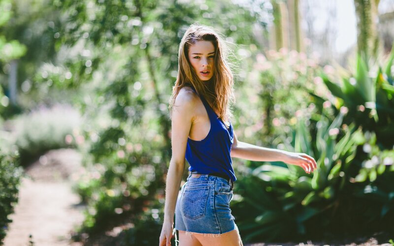 woman in blue top outdoors