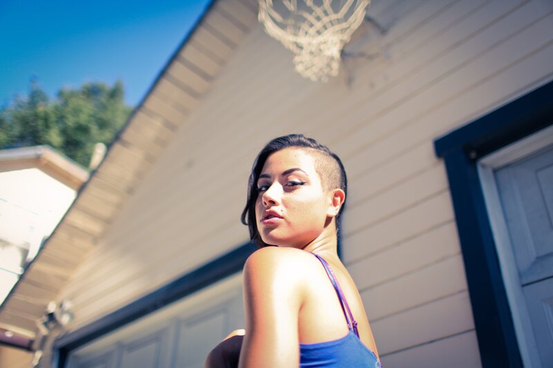 woman in blue top outdoors