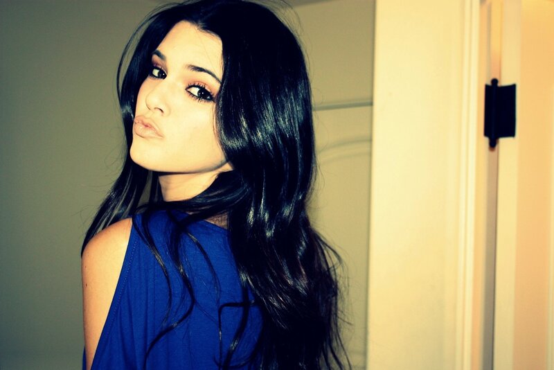 woman in blue top posing