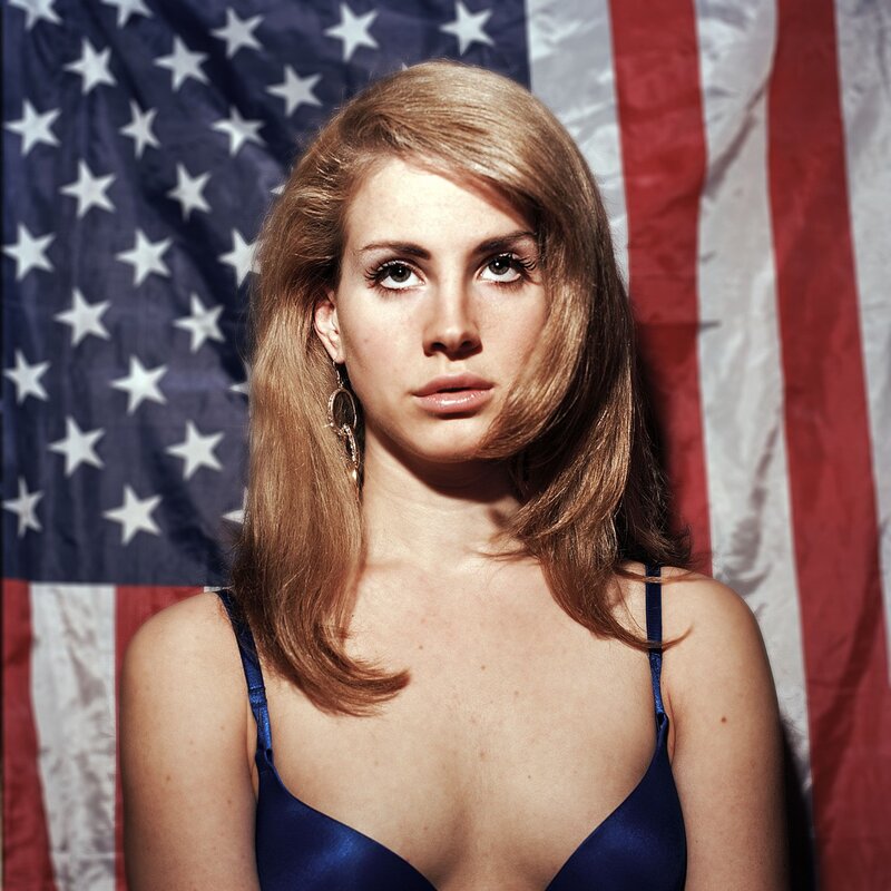 Woman in Blue Top — Serious, Photograph, American Flag