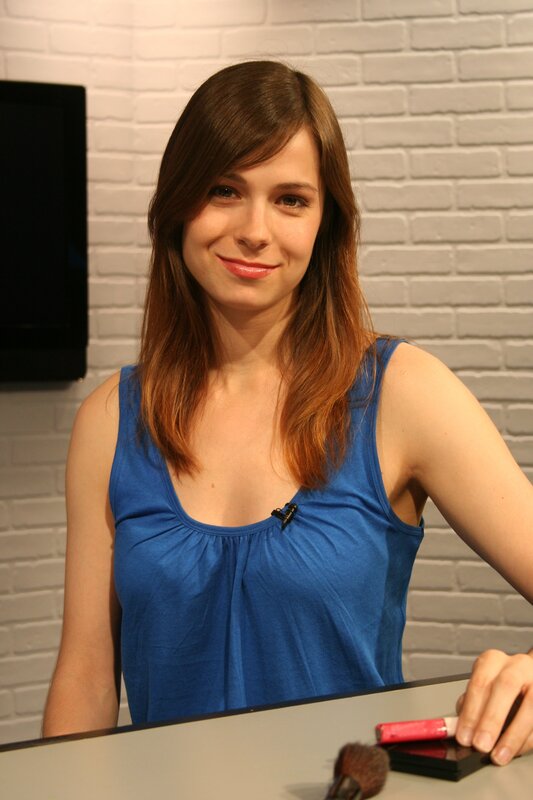 woman in blue top smiling