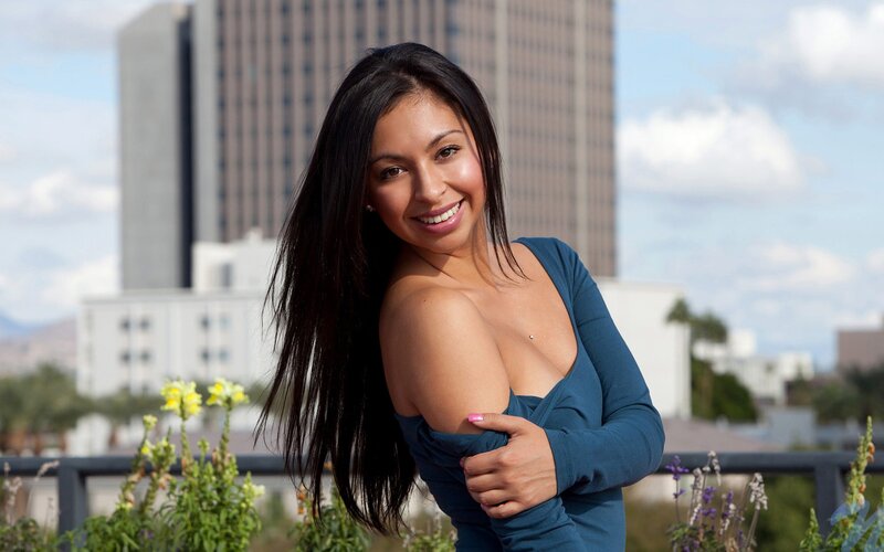 woman in blue top smiling
