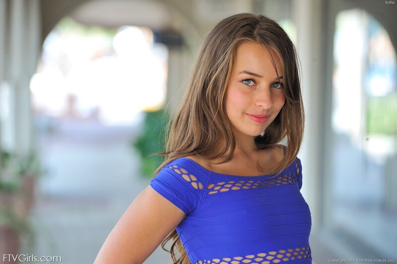 woman in blue top smiling