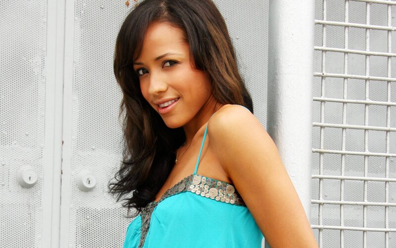 woman in blue top smiling