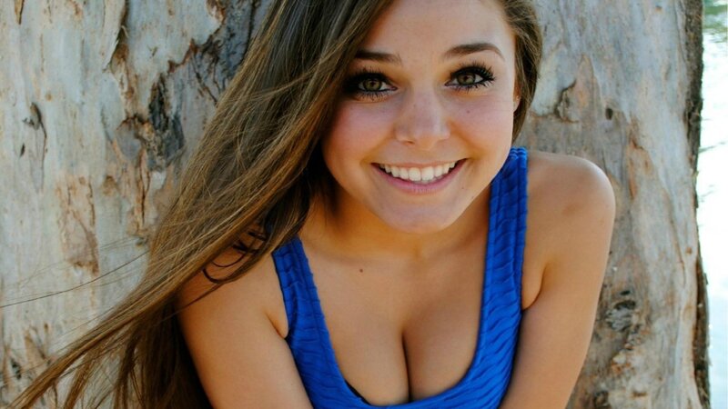 woman in blue top smiling