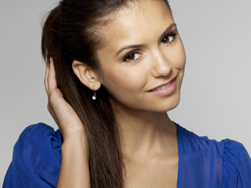 woman in blue top smiling