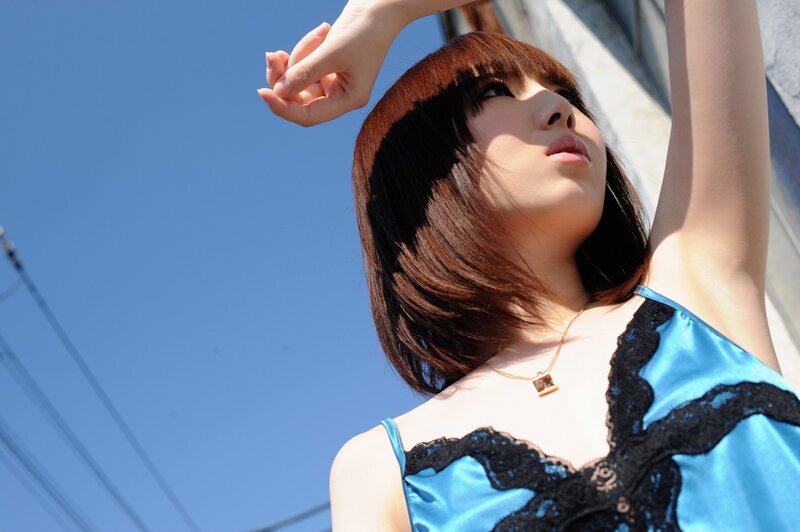 woman in blue top under sunlight