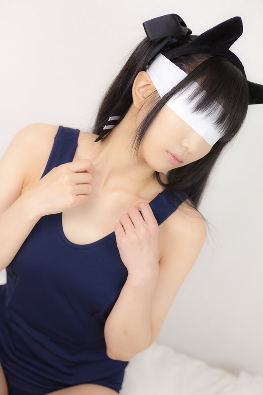 woman in blue top with blindfold