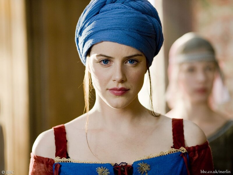 Woman in blue turban and red dress