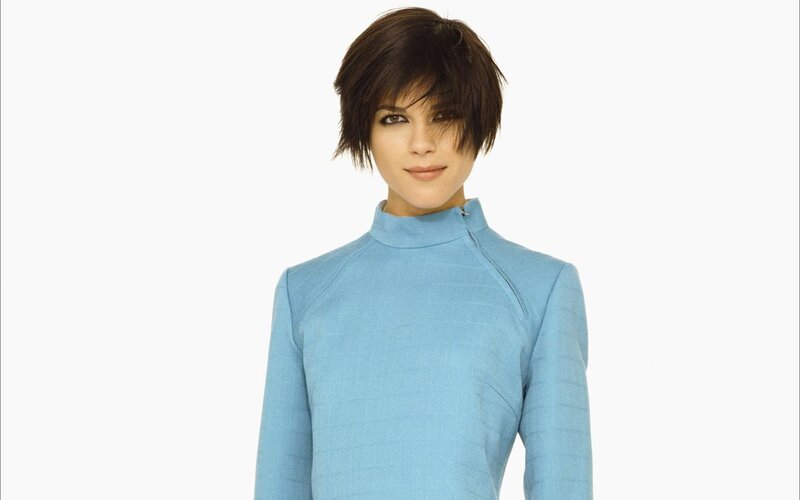 woman in blue turtleneck