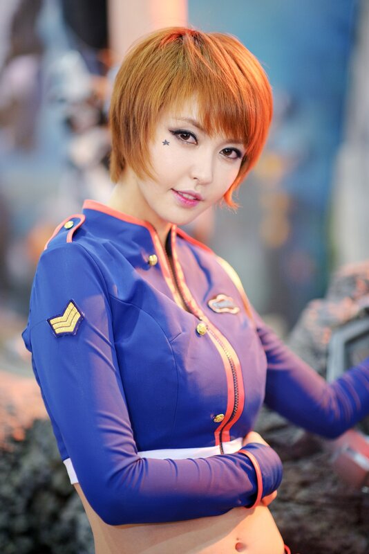 Woman in Blue Uniform — Confident, Photograph, Short Hair