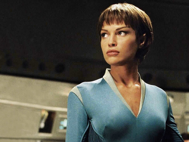 Woman in Blue Uniform — Serious