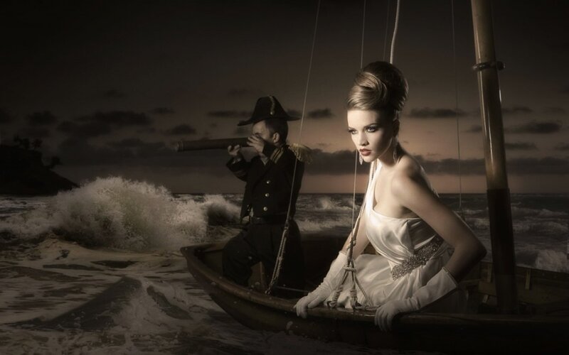 woman in boat with sailor