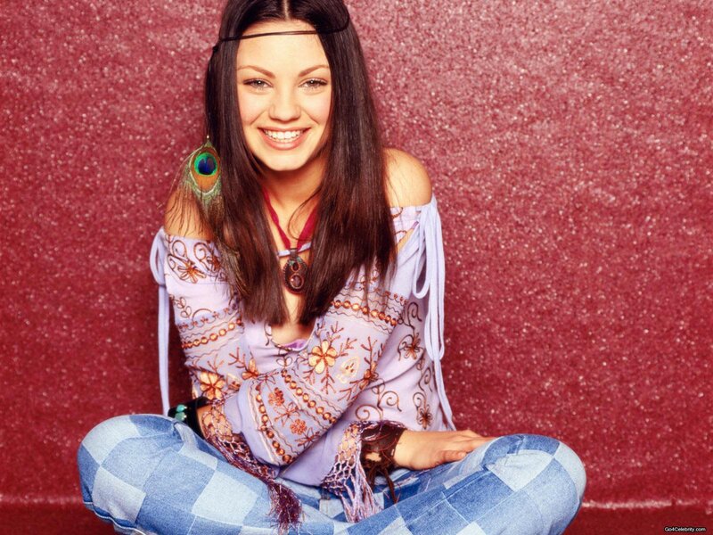 woman in boho outfit smiling