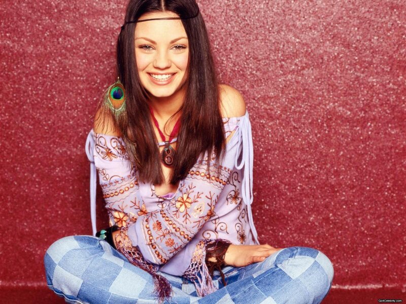 woman in boho outfit smiling