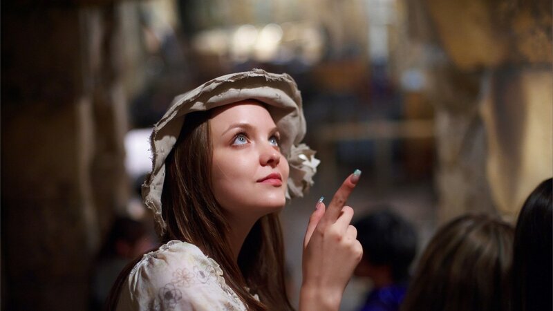 Woman in Bonnet Pointing