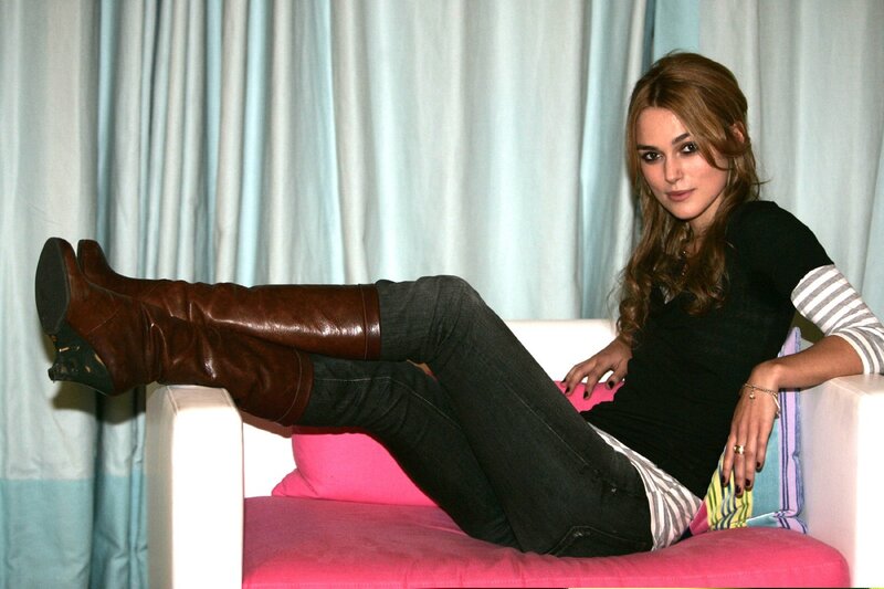 woman in boots on a couch