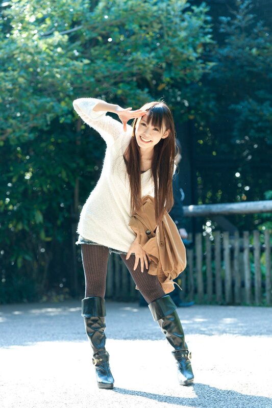 woman in boots posing outdoors