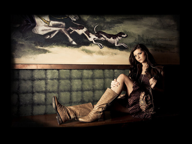 Woman in Boots Sitting — Brown