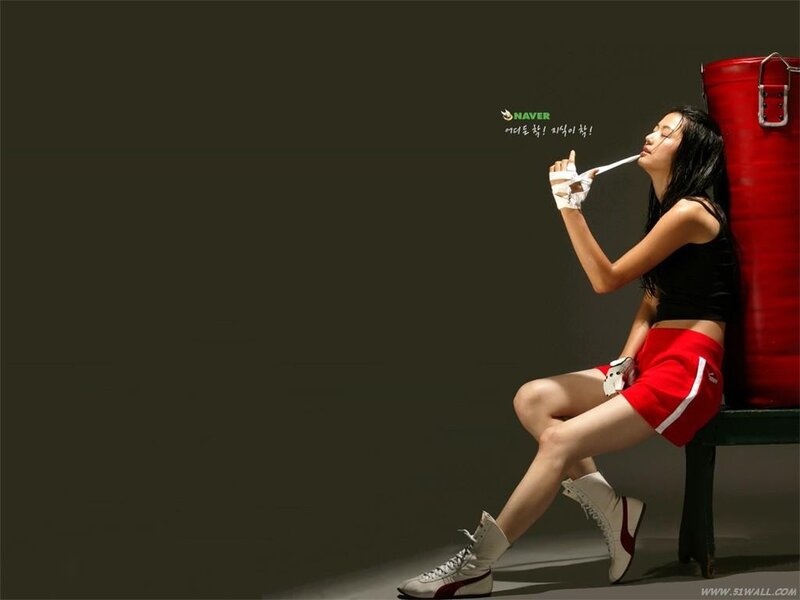 woman in boxing gear sitting