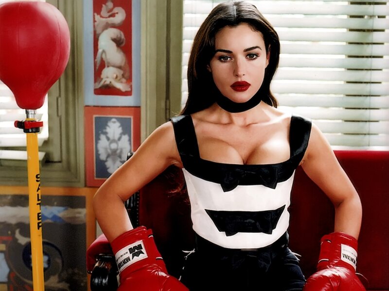 Woman in boxing gloves and dress