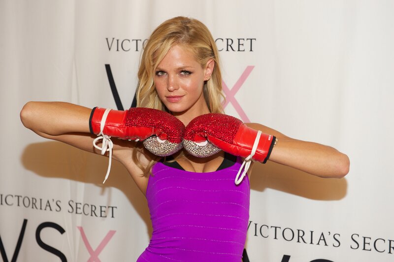 Woman in boxing gloves at event