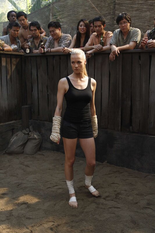 woman in boxing wraps in arena