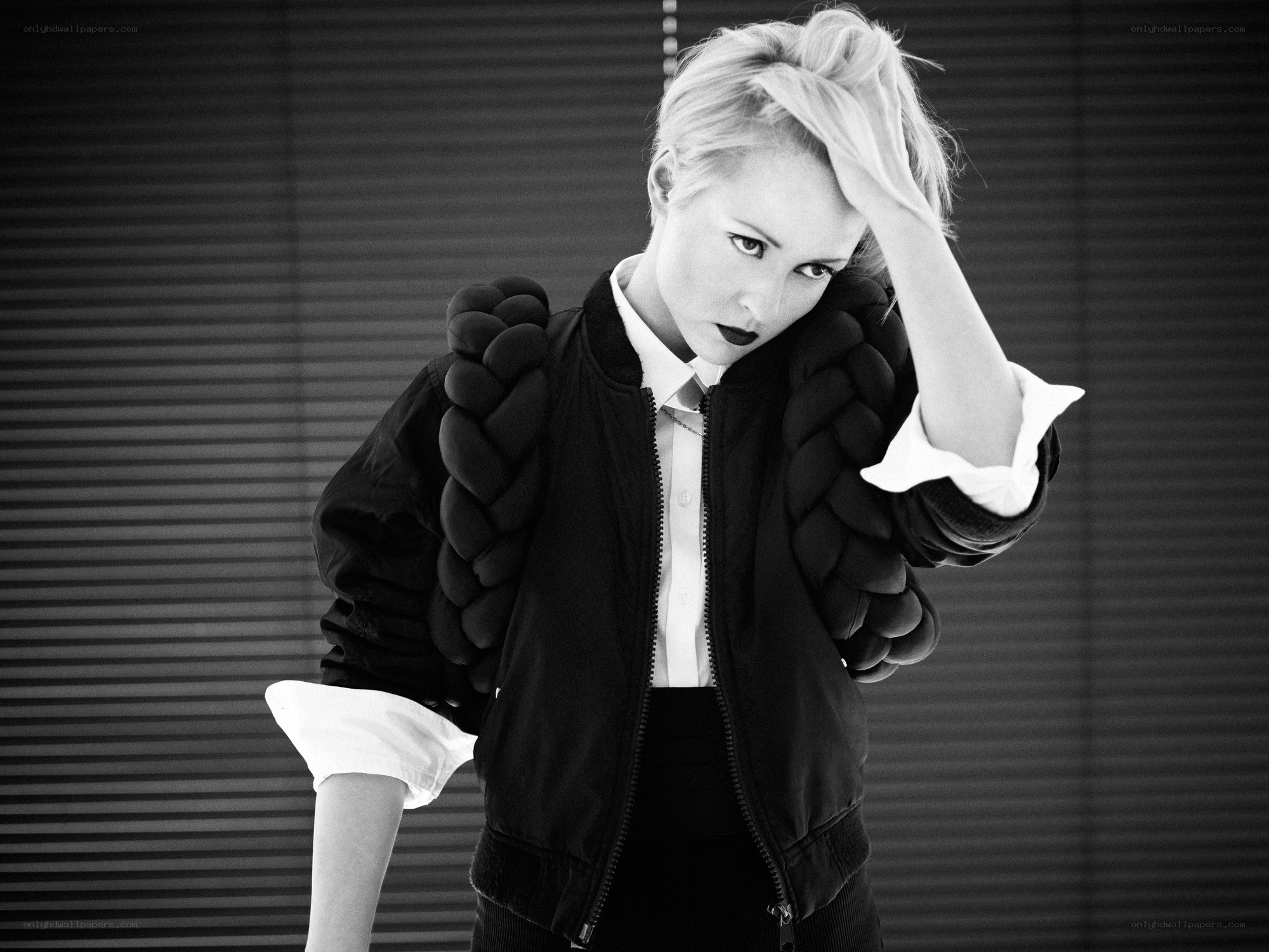woman in braided jacket