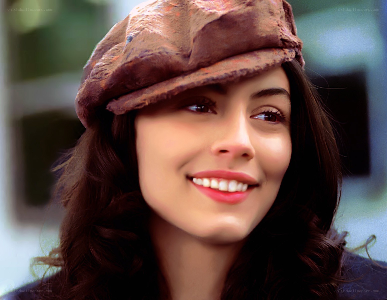 woman in brown cap smiling
